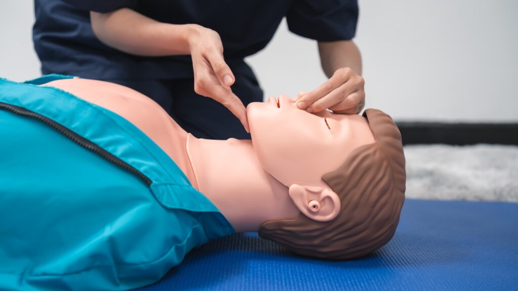 CPR Training ,Emergency and first aid class on cpr doll, Cardiopulmonary resuscitation, One part of the process resuscitation on unconscious person.