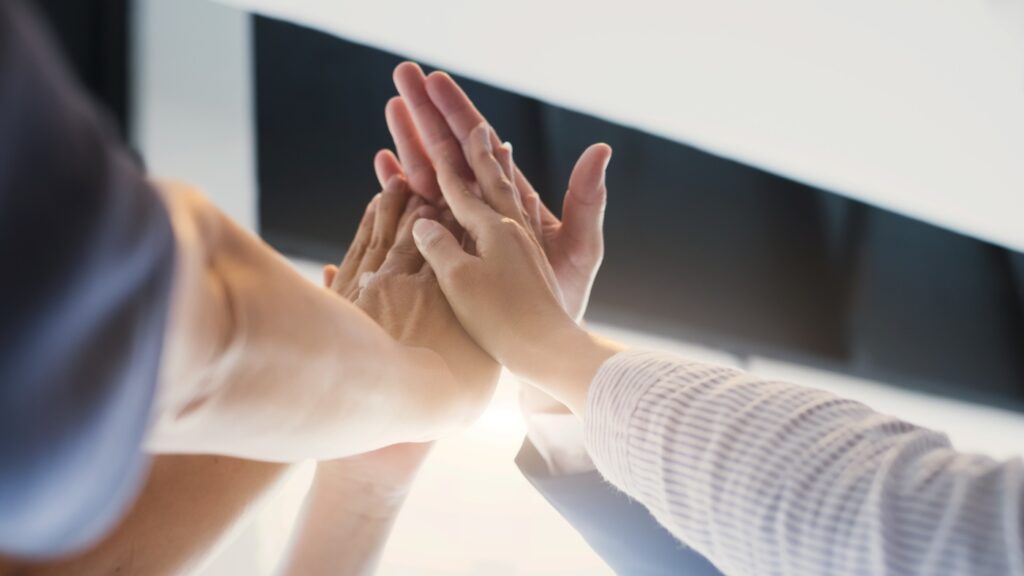 Hands doing high five. Teamwork Togetherness Collaboration Concept