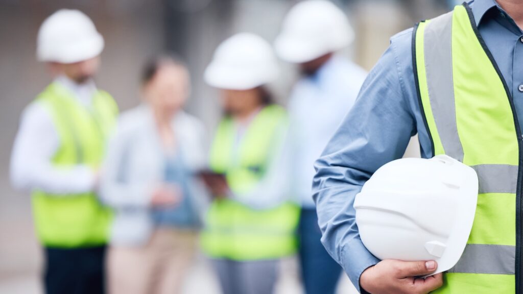 We put safety first. Shot of an unrecognizable architect holding a helmet at a building sit