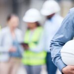We put safety first. Shot of an unrecognizable architect holding a helmet at a building sit